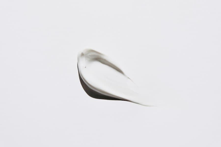 A single swatch of white cream drawn across a pale surface